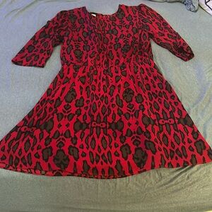 Red above the knee mini leopard dress with cut out in back. Size L